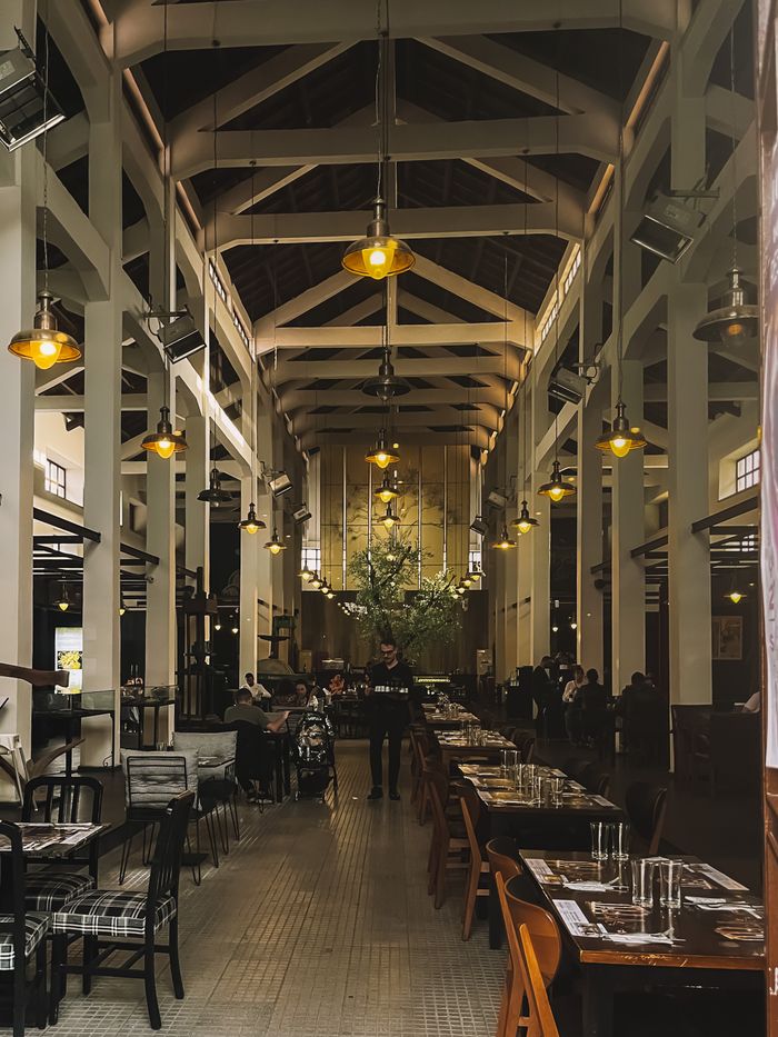 trusted-partner Spacious restaurant interior in Sicily with vintage design, ideal for dining experiences.